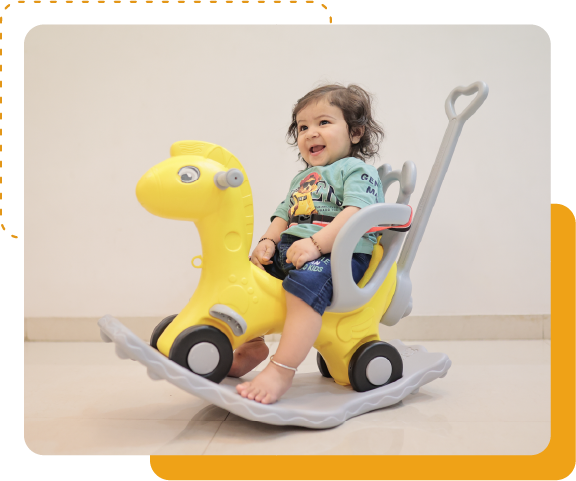 kid riding yellow toy car