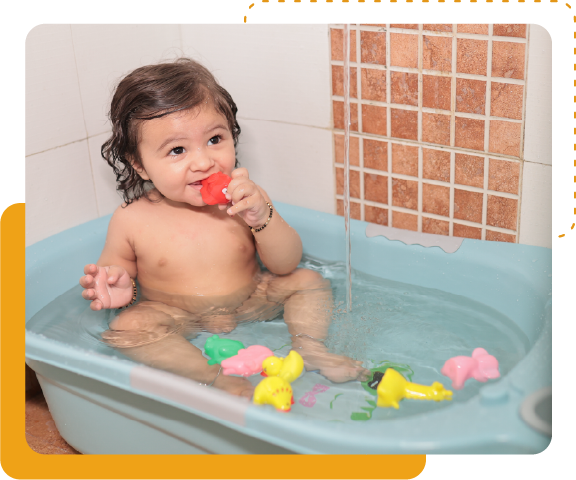 baby playing in bathtub